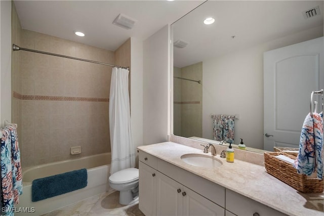 full bathroom featuring tile patterned flooring, vanity, toilet, and shower / tub combo with curtain