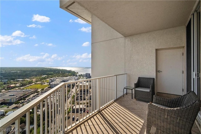 balcony featuring a water view