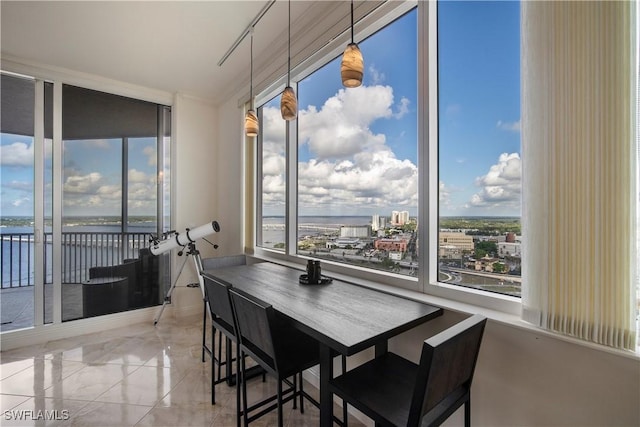 dining room with a water view