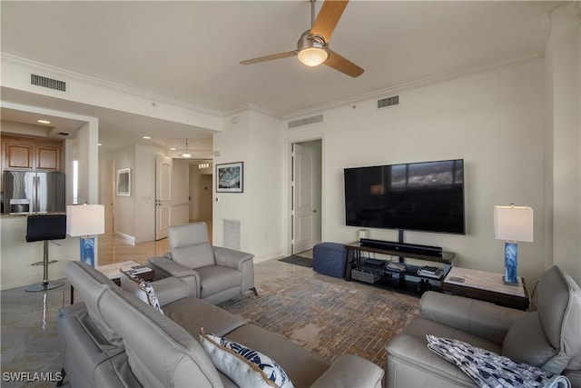 living room featuring ceiling fan and ornamental molding