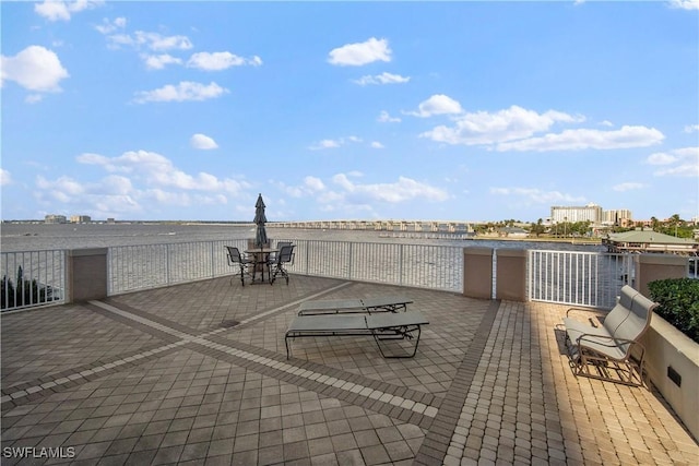 view of patio with a water view