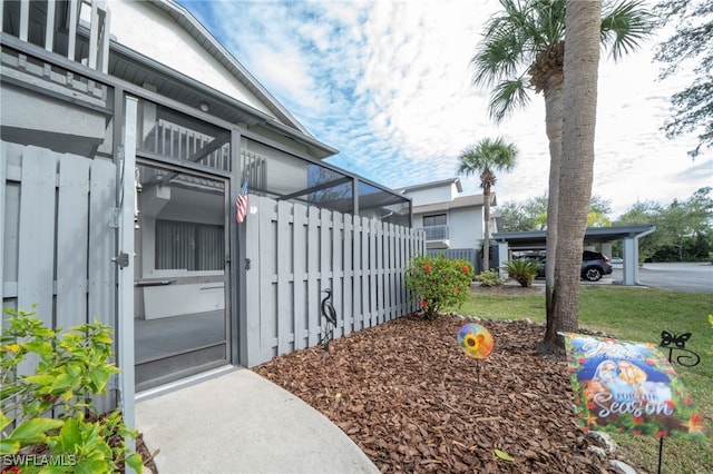 exterior space featuring a yard and a carport