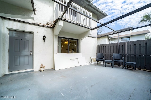 view of patio featuring a balcony