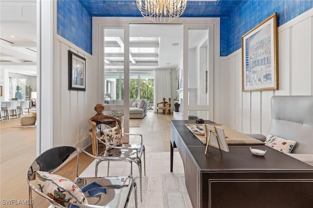 office with a notable chandelier and light hardwood / wood-style floors