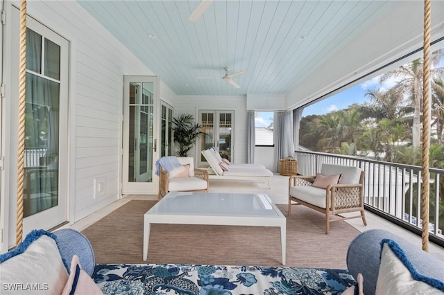 sunroom featuring wooden ceiling, ceiling fan, and french doors