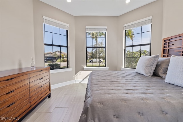 bedroom featuring recessed lighting and baseboards