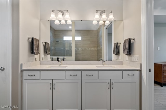 bathroom featuring a sink, double vanity, and walk in shower