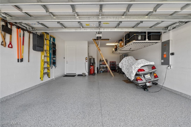 garage with water heater, electric panel, and a garage door opener