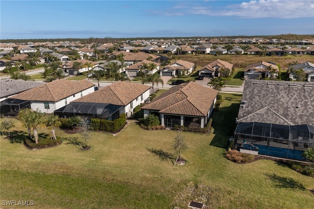 birds eye view of property with a residential view