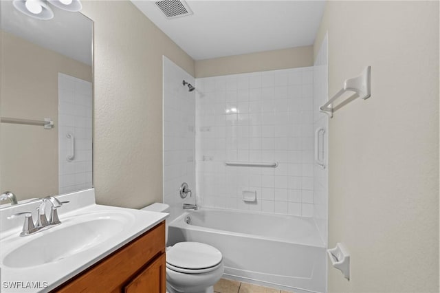 bathroom featuring visible vents, washtub / shower combination, toilet, tile patterned floors, and vanity