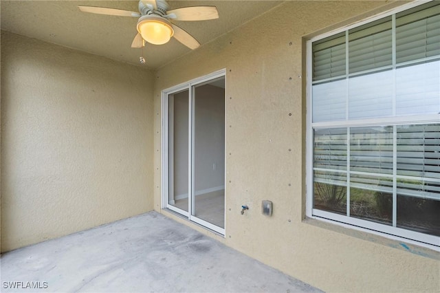 exterior space featuring a ceiling fan