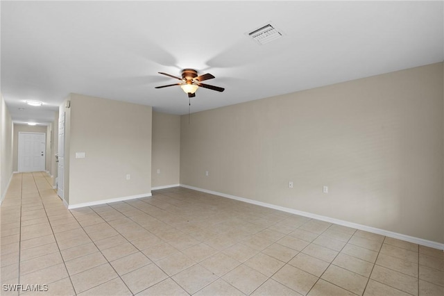 unfurnished room with light tile patterned flooring, baseboards, visible vents, and ceiling fan