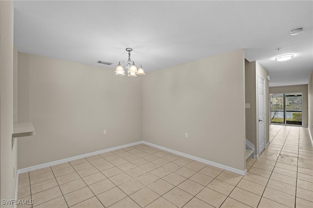 unfurnished room featuring light tile patterned floors, visible vents, baseboards, and a chandelier