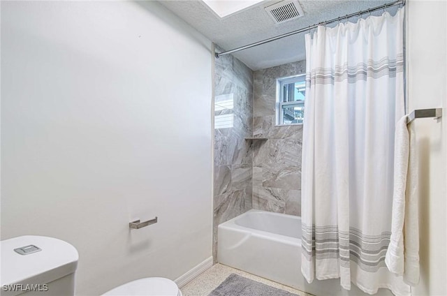 bathroom with toilet and shower / tub combo