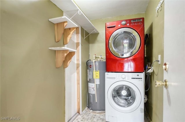 laundry area with stacked washer / dryer and water heater