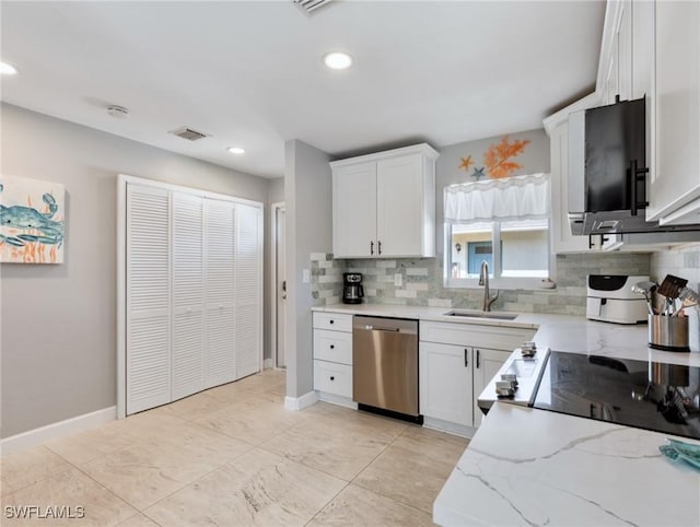 kitchen featuring white cabinetry, sink, decorative backsplash, stainless steel dishwasher, and light stone counters