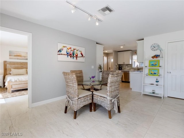 dining space with sink