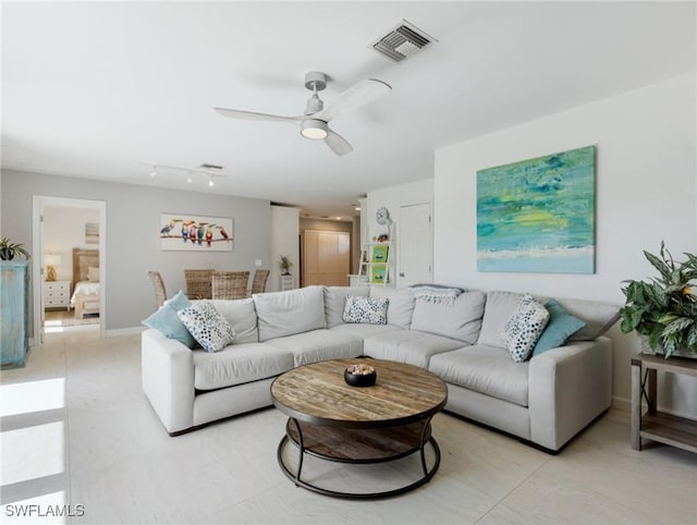 living room featuring ceiling fan