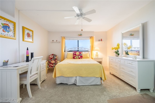 bedroom featuring light colored carpet and ceiling fan