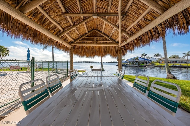 view of dock featuring a gazebo and a water view