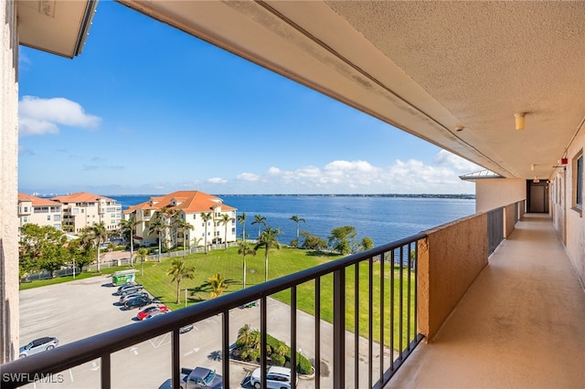 balcony featuring a water view