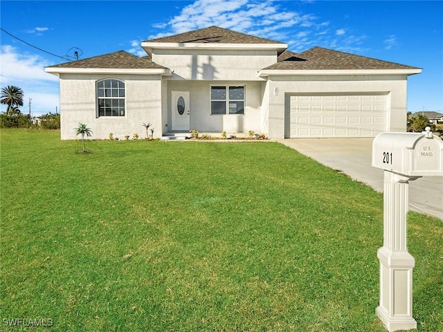 view of front of home featuring a garage and a front lawn