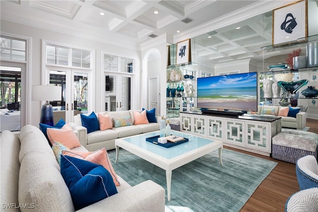 living room featuring beamed ceiling, ornamental molding, hardwood / wood-style floors, and coffered ceiling