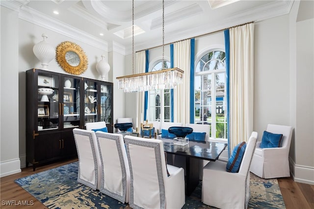 dining space with a wealth of natural light, crown molding, and dark wood-type flooring