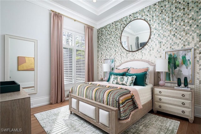 bedroom with wood-type flooring and ornamental molding