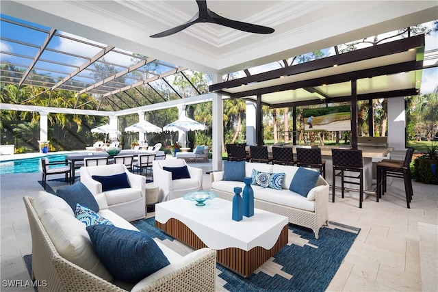 view of patio featuring ceiling fan, an outdoor bar, and an outdoor hangout area