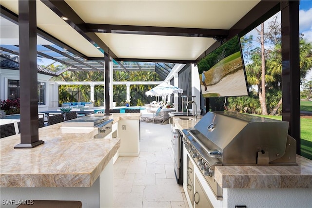 view of patio featuring glass enclosure, sink, a grill, area for grilling, and a swimming pool