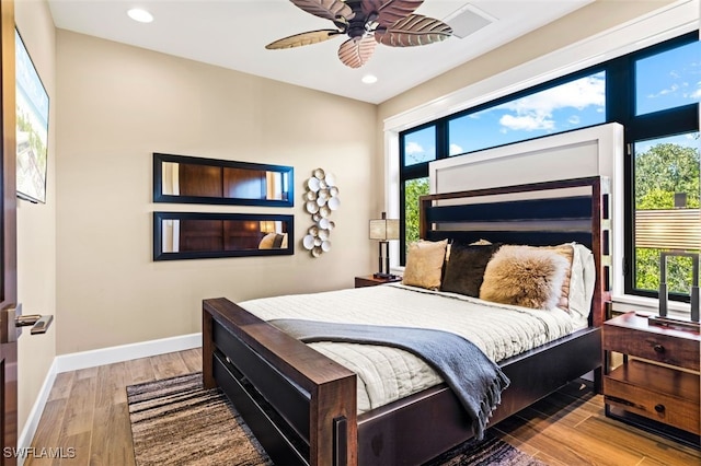 bedroom with wood-type flooring and ceiling fan