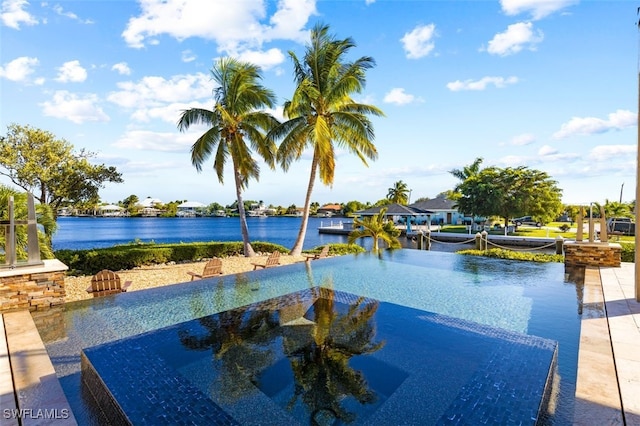 view of pool featuring a water view