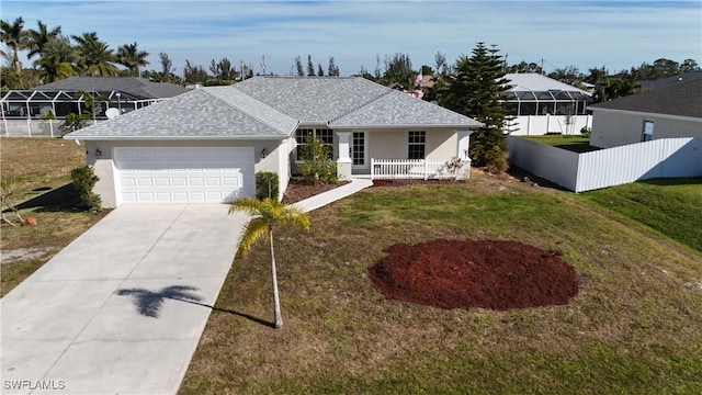 single story home with a garage and a front lawn