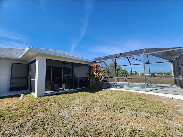 view of yard featuring glass enclosure