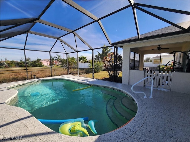 view of pool with a patio area, ceiling fan, and a lanai