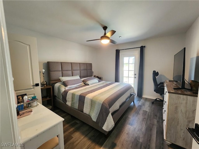 bedroom with dark hardwood / wood-style floors and ceiling fan