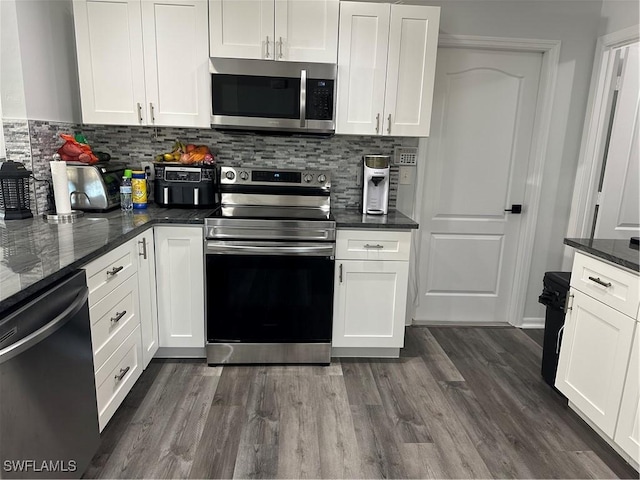 kitchen featuring white cabinets and appliances with stainless steel finishes