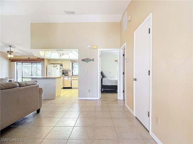 corridor with light tile patterned floors