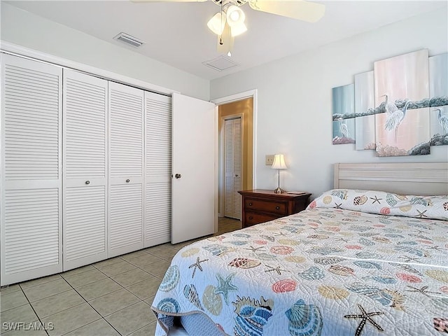 tiled bedroom featuring a closet and ceiling fan