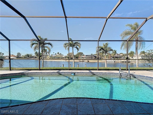 view of pool with a lanai and a water view