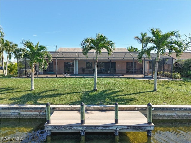 dock area featuring a yard, a water view, and a lanai