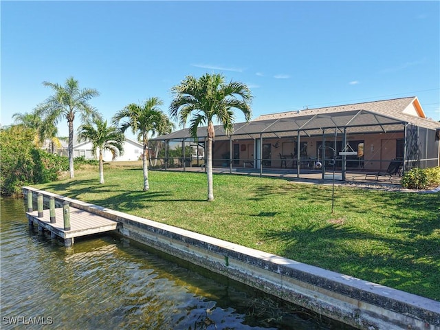 surrounding community featuring a lawn and a water view