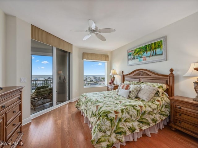 bedroom with access to exterior, ceiling fan, and wood-type flooring