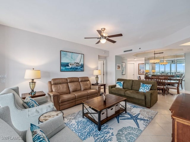 living room with light tile patterned floors and ceiling fan