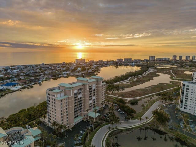 aerial view at dusk with a water view