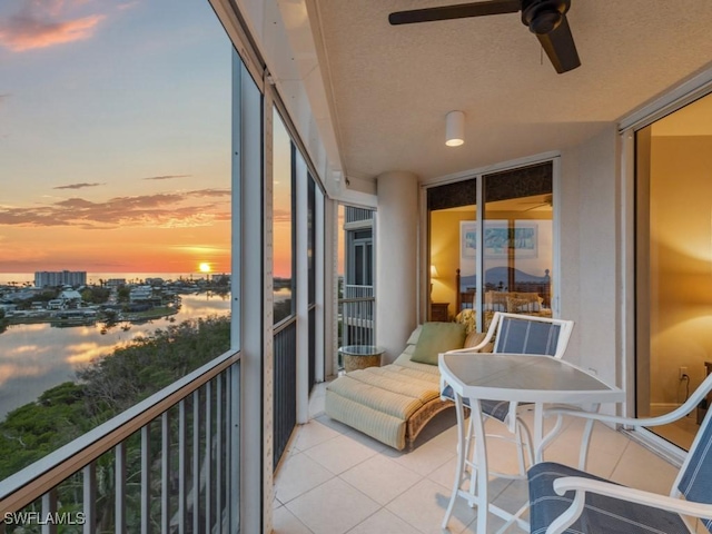 balcony at dusk with ceiling fan