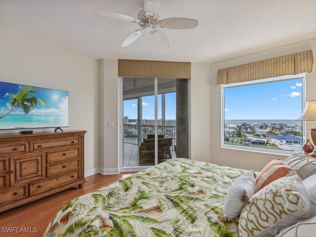 bedroom featuring ceiling fan, access to exterior, and light hardwood / wood-style flooring