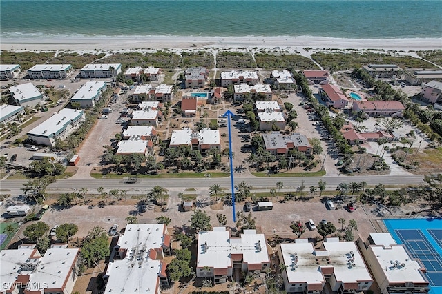 aerial view with a water view and a view of the beach