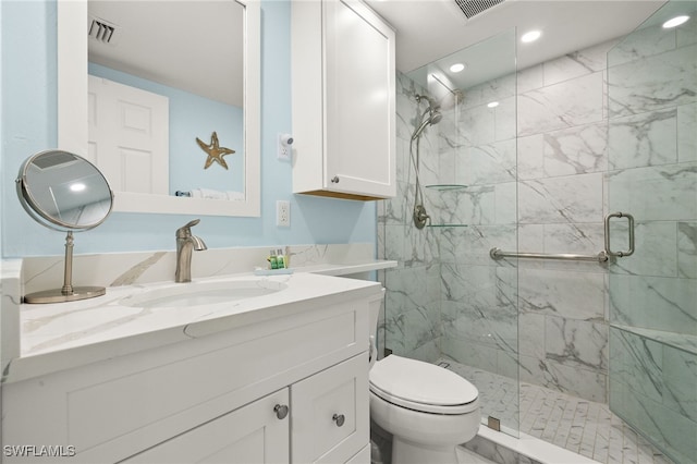 bathroom featuring vanity, toilet, and walk in shower